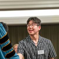 hand shaking on stage